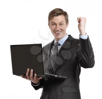 businessman with laptop celebrating victory with clenched fists and raised his hand. isolated on white