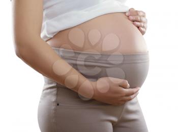 pregnant woman in brown pants for pregnant women and a white blouse close up. isolated with clipping paths