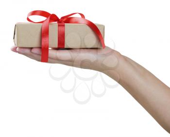Close up of female hand holding gift box isolated on white background