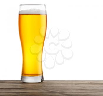 glasses of beer on a wooden table. Isolated on a white background.