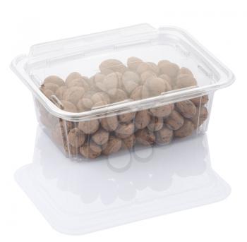 pecan nuts in a transparent plastic food box isolated on a white background with clipping path