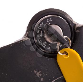 Key of an old motorcycle, selective focus, isolated