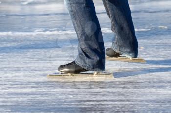 A ice skater is skating on the famous dutch Bonkevaart Friese Elfstedentocht