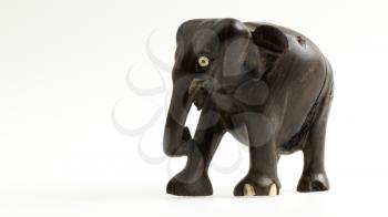 Very old ivory statue of an elephant isolated on a white beckground