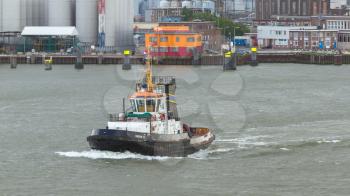 ROTTERDAM, THE NETHERLANDS - JUNE 22: Close-up of a tugboat in the busy port of Rotterdam, Rotterdam, Holland, June 22, 2012
