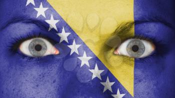 Close up of eyes. Painted face with flag of Bosnia and Herzegovina