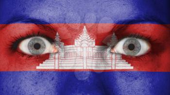Close up of eyes. Painted face with flag of Cambodia