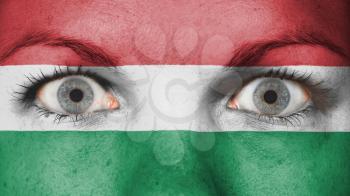 Close up of eyes. Painted face with flag of Hungary