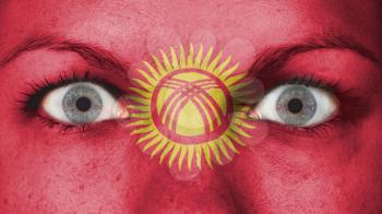 Close up of eyes. Painted face with flag of Kyrgyzstan