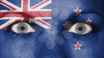 Close up of eyes. Painted face with flag of New Zealand