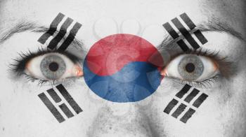 Close up of eyes. Painted face with flag of South Korea