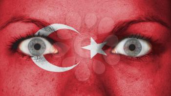 Close up of eyes. Painted face with flag of Turkey