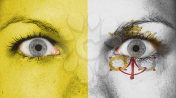 Close up of eyes. Painted face with flag of Vatican City