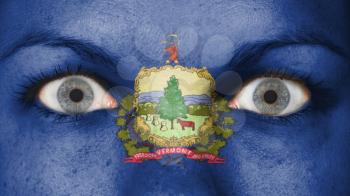 Close up of eyes. Painted face with flag of Vermont