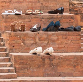 Shoes at the old entrance of a mosque