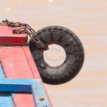 Fender on a red boat in the Mekong delta, south Vietnam