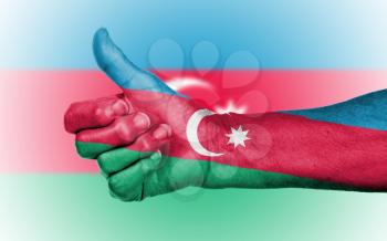 Old woman giving the thumbs up sign, isolated, flag of Azerbaijan