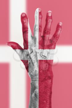 Isolated old hand with flag, European Union, Denmark