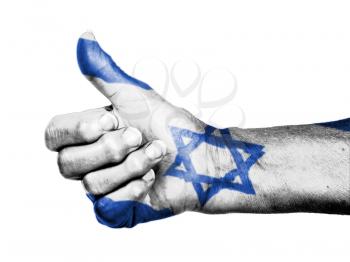 Old woman with arthritis giving the thumbs up sign, wrapped in flag pattern, Israel