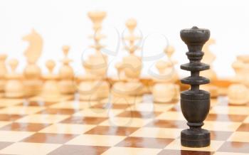 Black chess king isolated on a chessboard