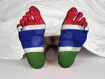 Feet with flag, sleeping or death concept, flag of The Gambia