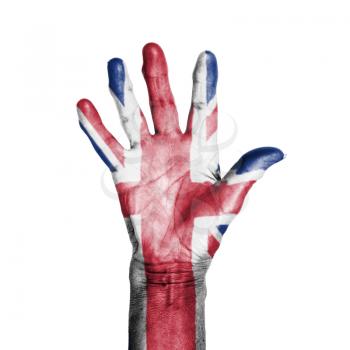 Hand of an old woman, wrapped with a pattern of the flag of the UK, isolated on white