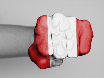 Fist of a man punching, flag of Peru