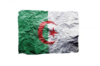 Close up of a curled paper on white background, print of the flag of Algeria