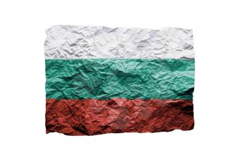 Close up of a curled paper on white background, print of the flag of Bulgaria