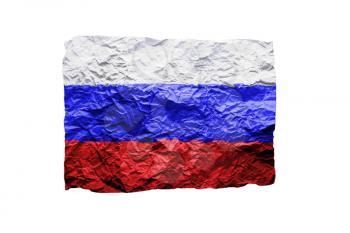 Close up of a curled paper on white background, print of the flag of Russia
