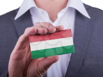 Businessman showing card, matte paper effect, Hungary