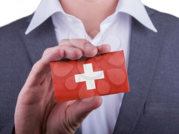 Businessman showing card, matte paper effect, Switzerland