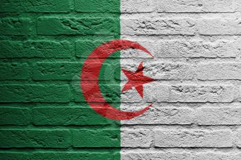 Brick wall with a painting of a flag isolated, Algeria