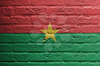 Brick wall with a painting of a flag isolated, Burkina Faso