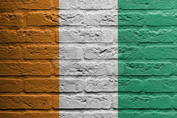Brick wall with a painting of a flag isolated, Ivory Coast
