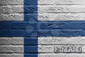 Brick wall with a painting of a flag isolated, Finland