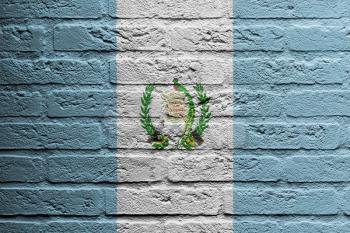 Brick wall with a painting of a flag isolated, Guatemala
