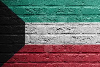 Brick wall with a painting of a flag isolated, Kuwait