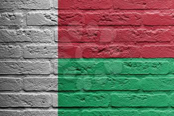 Brick wall with a painting of a flag isolated, Madagascar