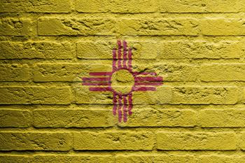 Brick wall with a painting of a flag isolated, New Mexico