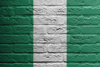 Brick wall with a painting of a flag isolated, Nigeria