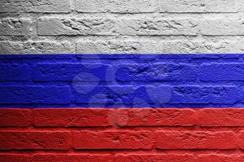 Brick wall with a painting of a flag isolated, Russia
