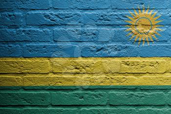 Brick wall with a painting of a flag isolated, Rwanda