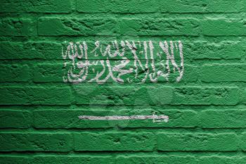 Brick wall with a painting of a flag isolated, Saudi Arabia