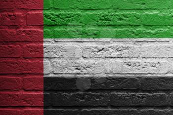 Brick wall with a painting of a flag isolated, The United Arab Emirates