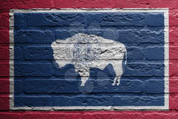 Brick wall with a painting of a flag isolated, Wyoming