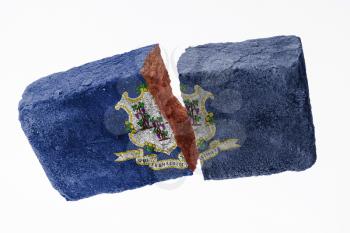 Rough broken brick, isolated on white background, flag of Connecticut
