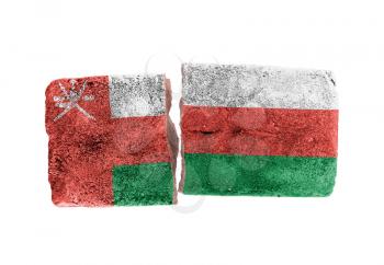Rough broken brick, isolated on white background, flag of Oman