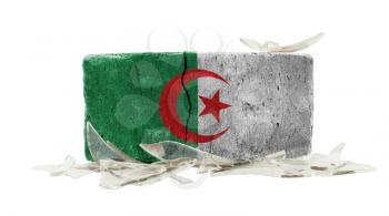 Brick with broken glass, violence concept, flag of Algeria
