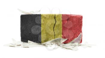 Brick with broken glass, violence concept, flag of Belgium